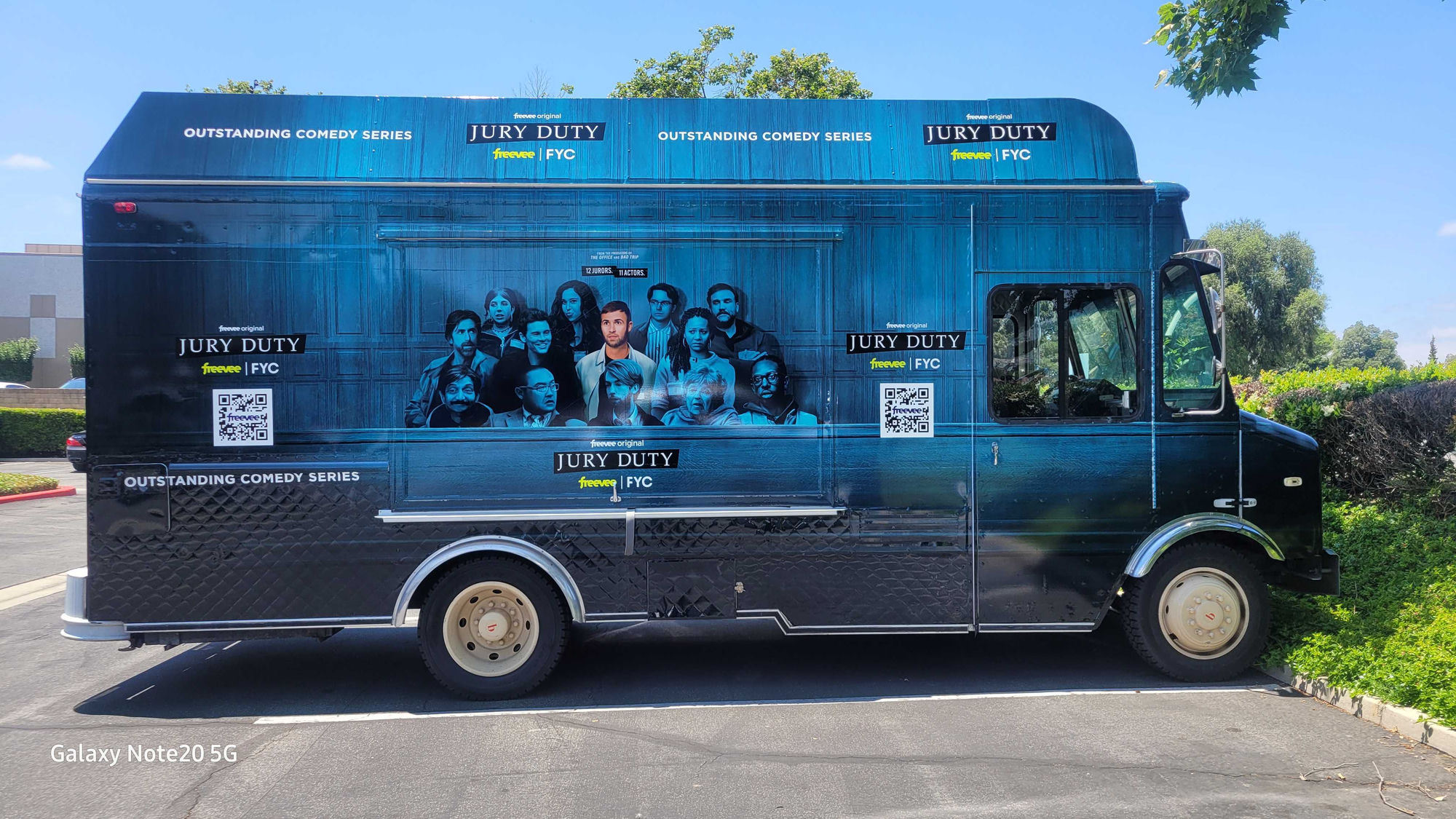 The Lime Truck Amazon Freevee Jury Duty brand activation — black and blue branded food truck wrap featuring the Jury Duty cast photo, 'Outstanding Comedy Series' messaging, FYC Emmy campaign branding, and QR codes for streaming