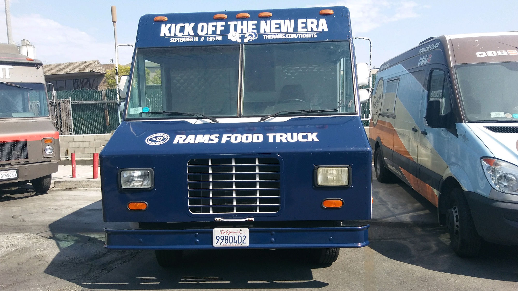 The Lime Truck Los Angeles Rams brand activation — front view of fully wrapped 'Rams Food Truck' showing 'Kick Off the New Era' top banner promoting the September 10 Colts vs Rams season opener at LA Memorial Coliseum