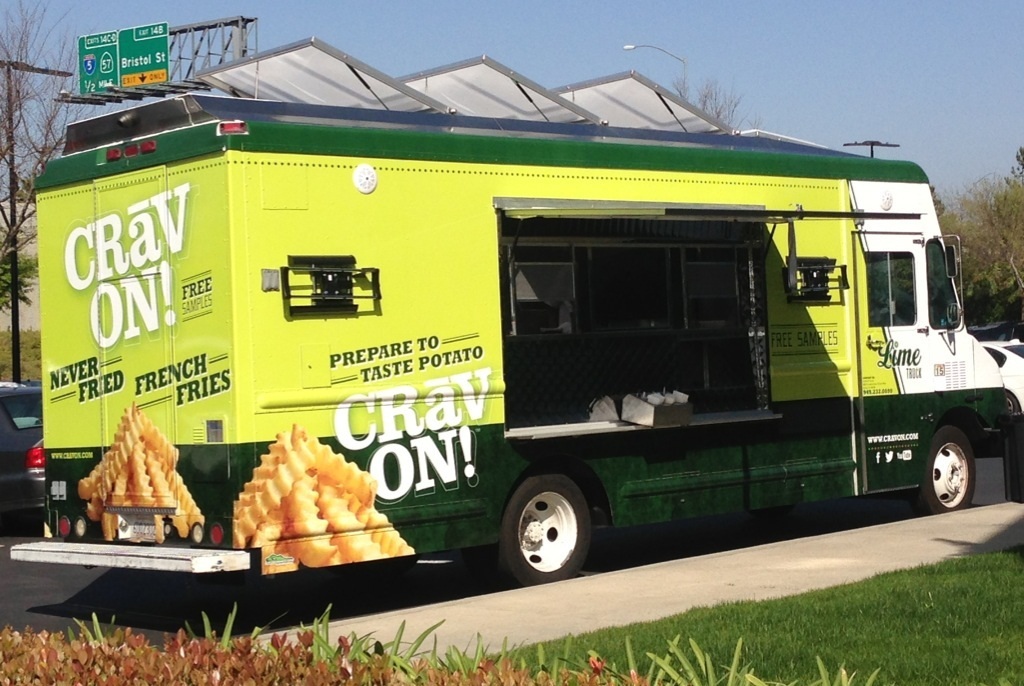 The Lime Truck Simplot brand activation — Crav'N Fresh neon green branded food truck wrap with 'Prepare to Taste Potato' messaging and crinkle-cut french fry imagery for the Simplot CPG sampling tour