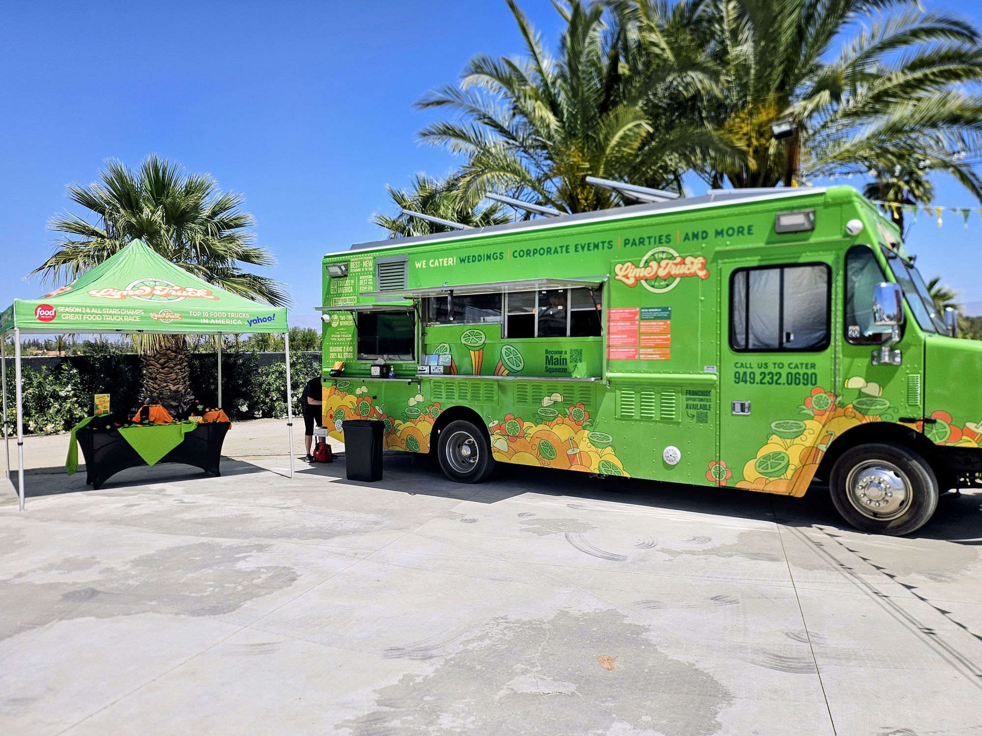 The Lime Truck's own self-branded food truck — three-truck fleet, Food Network Champion of Champions credentials displayed, base configuration before brand wrap installation. Owned and operated by The Lime Truck since 2010.