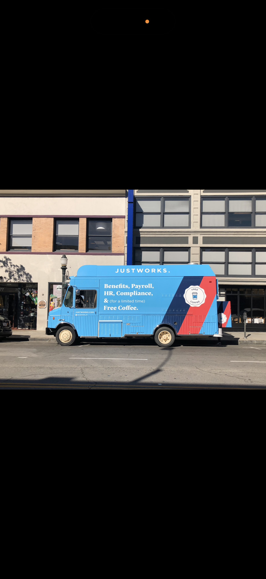 Justworks branded food truck wrap by The Lime Truck — blue and red vinyl with payroll and HR value prop